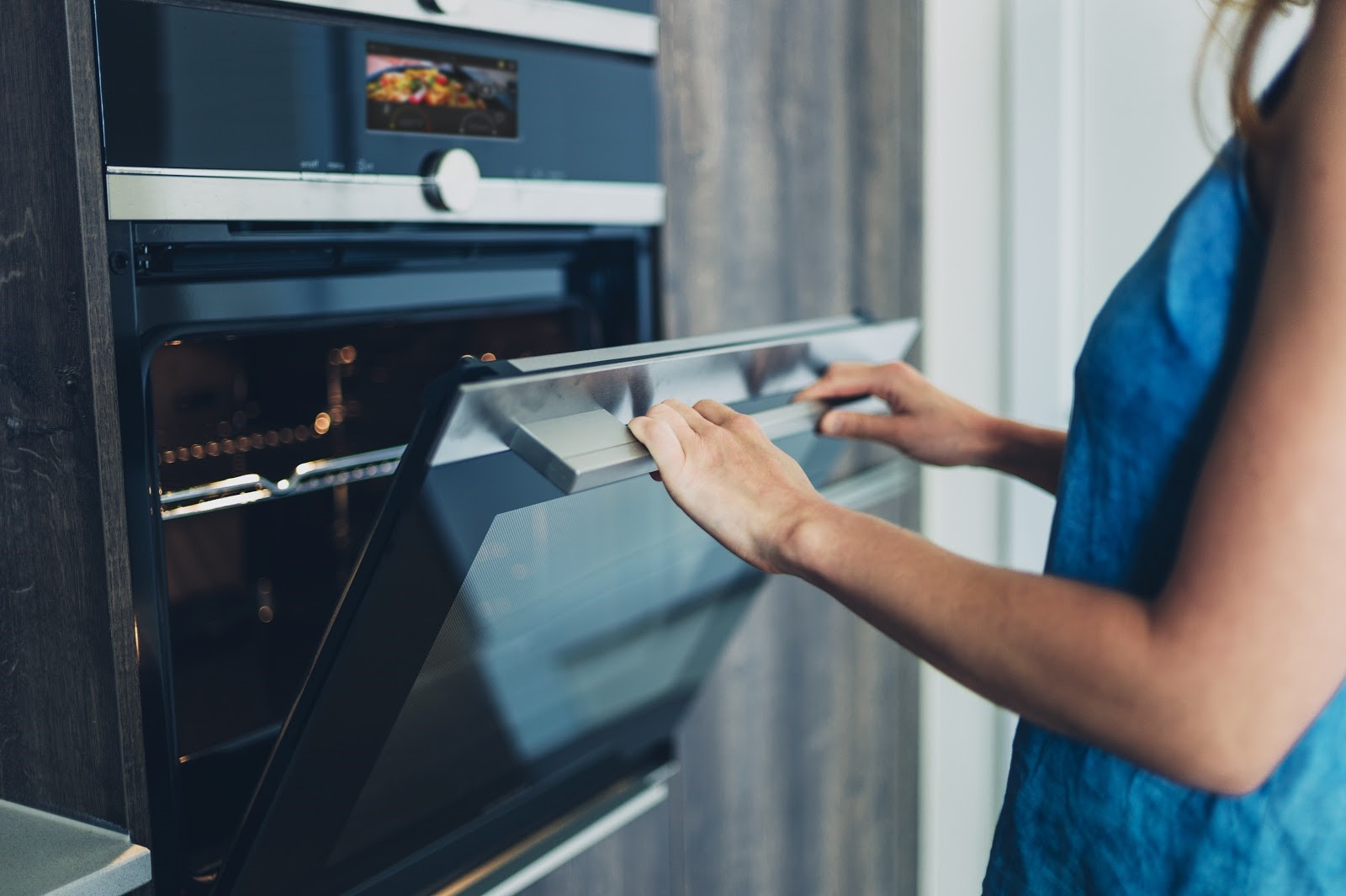 woman using oven with voice activation